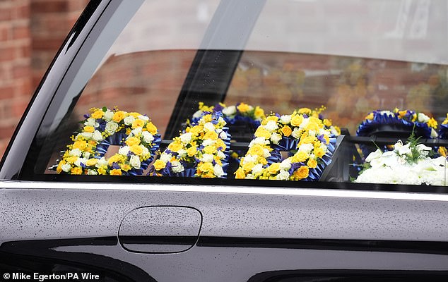 A hearse featured floral 'dad' and 'grandad' tributes at today's service for the family man and late football great