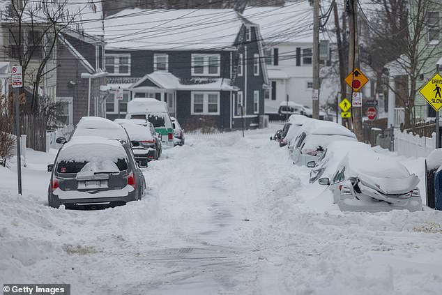 BOSTON, MASSACHUSETTS - JANUARY 26: Snow covers cars following a major storm storm on January 26, 2026 in Boston, United States. A massive winter storm is brought over a foot of snow to the region. (Photo by Scott Eisen/Getty Images)
