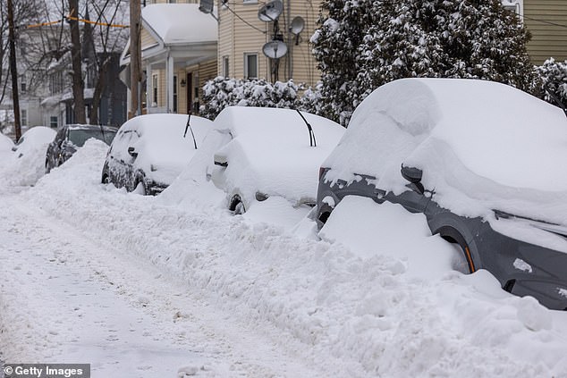 BOSTON, MASSACHUSETTS - JANUARY 26: Snow covers cars following a major storm storm on January 26, 2026 in Boston, United States. A massive winter storm is brought over a foot of snow to the region. (Photo by Scott Eisen/Getty Images)