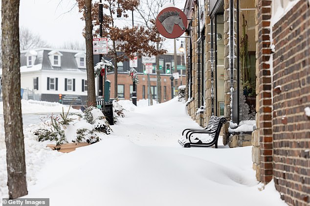 BOSTON, MASSACHUSETTS - JANUARY 26: Over a foot of snow covers the sidewalk following a major storm storm on January 26, 2026 in Boston, United States. A massive winter storm is brought over a foot of snow to the region. (Photo by Scott Eisen/Getty Images)