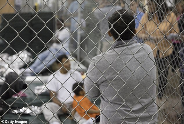 Illegal border crossers, who were detained by US Border Patrol agents, are seen in a jail at the Central Processing Center in McAllen, Texas, pictured in June 2018 during Trump's first term