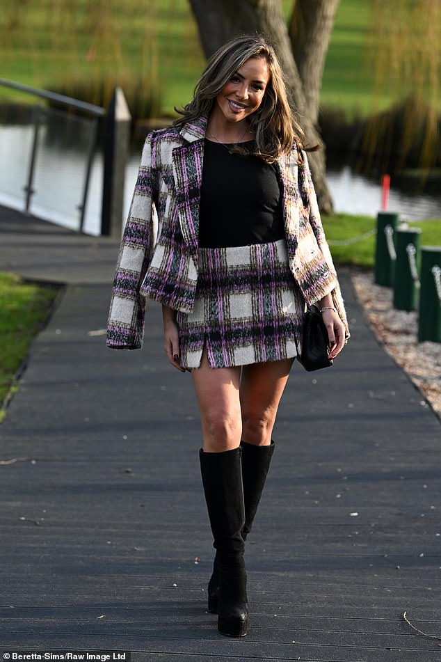 Elma Pazar put on a leggy display in a tweed mini skirt, black T-shirt and a matching jacket thrown over her shoulders