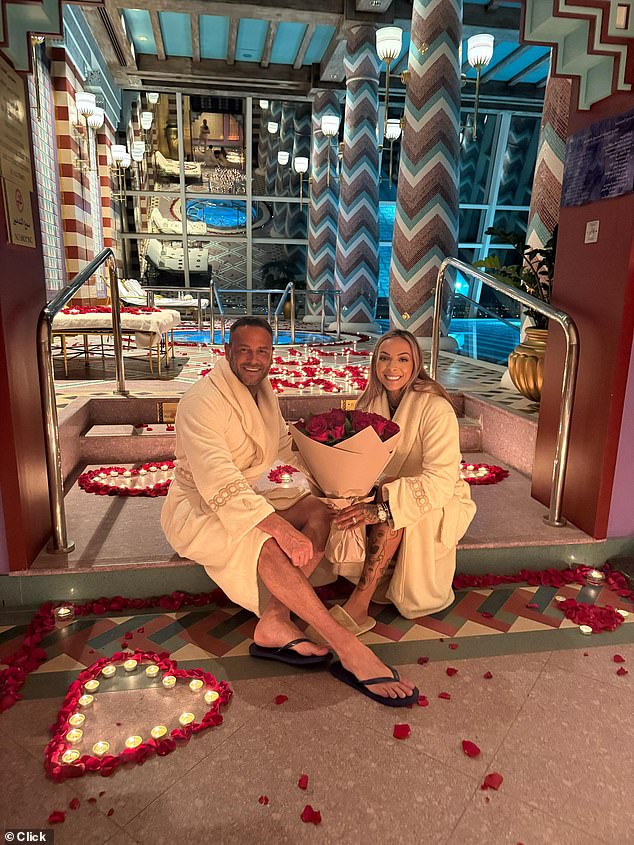 As well as rose petals and tealights spelling out 'Will you marry me' on the floor of a luxurious spa, both women were presented with a bouquet of roses, wrapped in the same brown paper