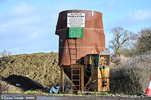 Mr Powell's notorious sign welcoming drivers to 'Peopleton: a murderous lawless godforsaken place'