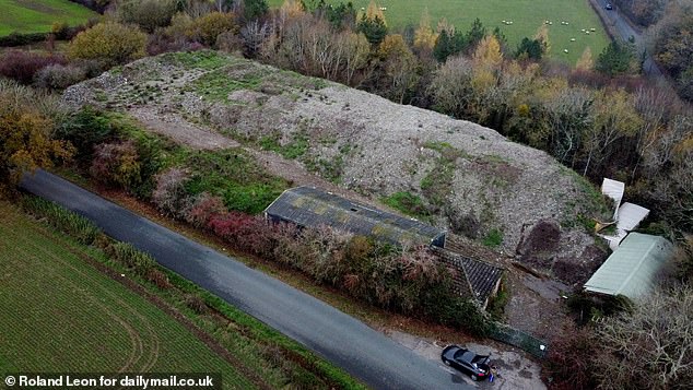 The colossal waste pile, which has now been grassed over, pictured from the air