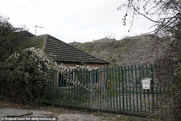 At Bruce's old site, The Crabbe Yard, piles of waste 'the size of eight semi-detached houses' can still be seen behind a padlocked fence