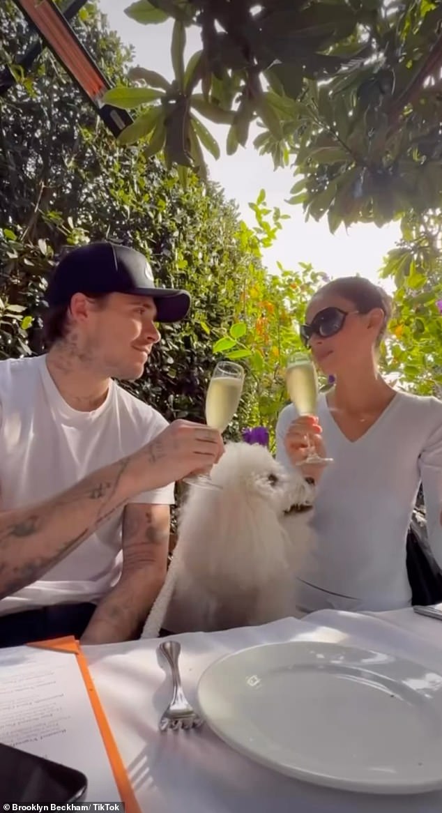 The couple even toasted with champagne as they enjoyed lunch in the sunshine