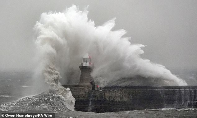 Waves crash against South Shields lighthouse on the North East coast during Storm Ingrid last week