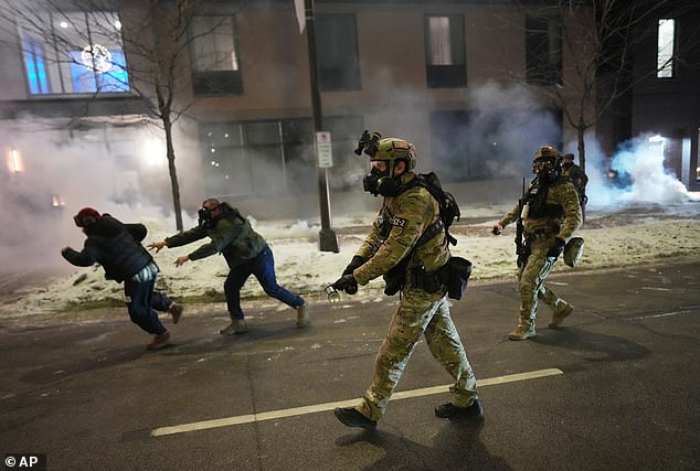 Federal agents try to clear demonstrators in Minneapolis using tear gas