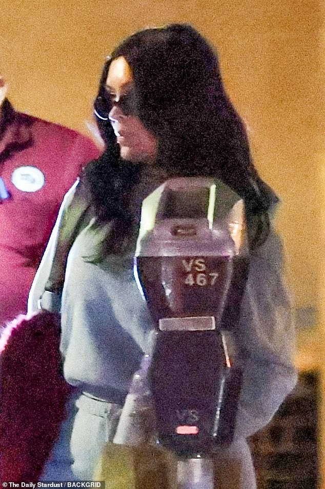 She wore black sunglasses for the family's nighttime outing