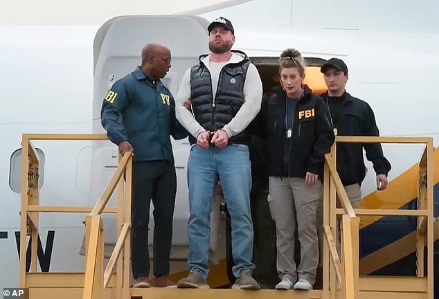 The former snowboarder, 44, is pictured being taken off a plane in handcuffs in California