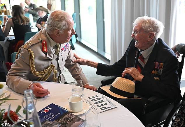King Charles III with Charlie Richards, 104, during a reception for VJ veterans and their families hosted by the Royal British Legion at The Aspects Building following a national Service of Remembrance to mark the 80th Anniversary of VJ Day