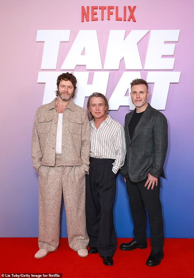 Take That now comprises of Howard, Mark and Gary (pictured at the premiere of their Netflix series at Battersea Power Station on Monday)
