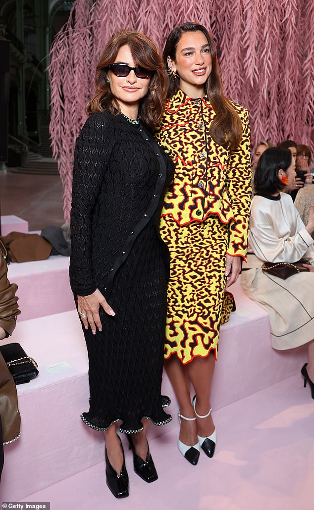 Actress Penelope, 51, looked chic in a classic Chanel jacket and matching skirt as well as dark shades