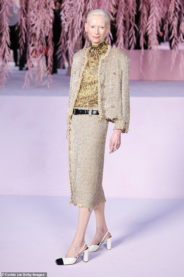 She added a glitzy gold top to the look