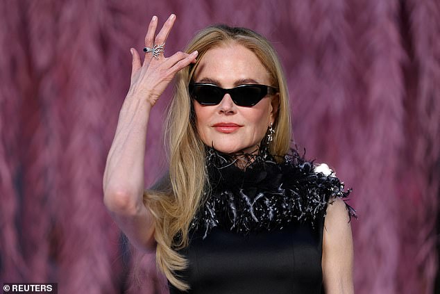 Nicole opted for stylish black Chanel shades