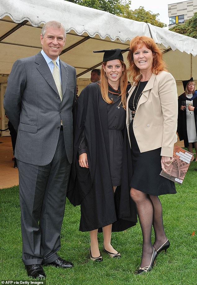 Princess Beatrice poses for photograph with Andrew and Sarah Ferguson following her graduation ceremony at Goldsmiths College, in London, on September 9 2011