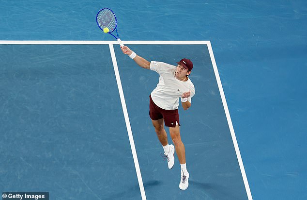 MELBOURNE, AUSTRALIA - JANUARY 27: Alex de Minaur of Australia plays a forehand against Carlos Alcaraz of Spain during the Men's Singles Quarter Final match on day 10 of the 2026 Australian Open at Melbourne Park on January 27, 2026 in Melbourne, Australia. (Photo by Darrian Traynor/Getty Images)