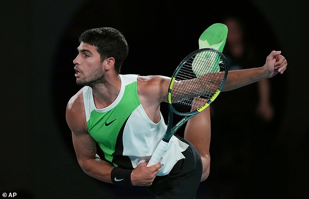 Carlos Alcaraz of Spain serves to Alex de Minaur of Australia during their quarterfinal match at the Australian Open tennis championship in Melbourne, Australia, Tuesday, Jan. 27, 2026. (AP Photo/Asanka Brendon Ratnayake)