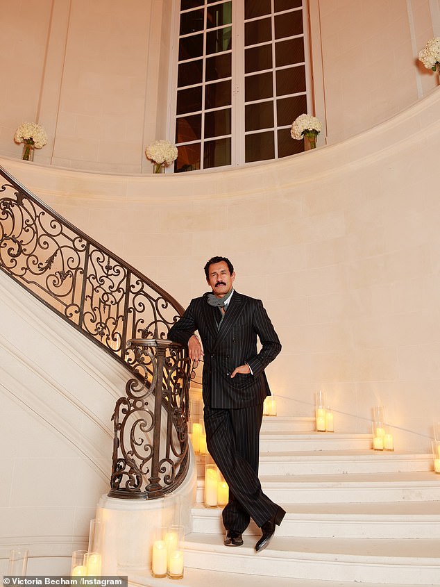 French designer Haider Ackermann looked suave in a pinstripe suit