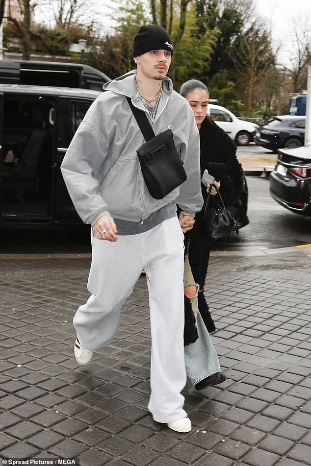 He was joined by his son Romeo who wore a grey tracksuit and his stunning girlfriend Kim Turnbull