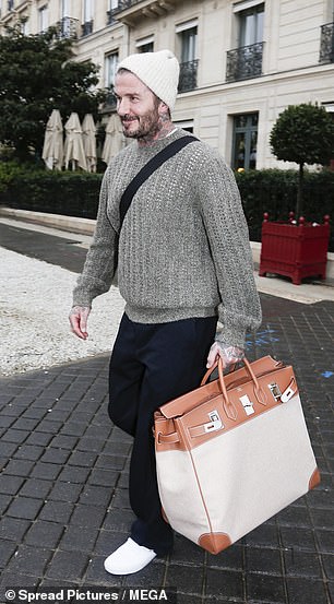 He carried the huge designer bag