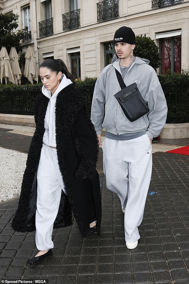 Romeo also wore a stylish black bag