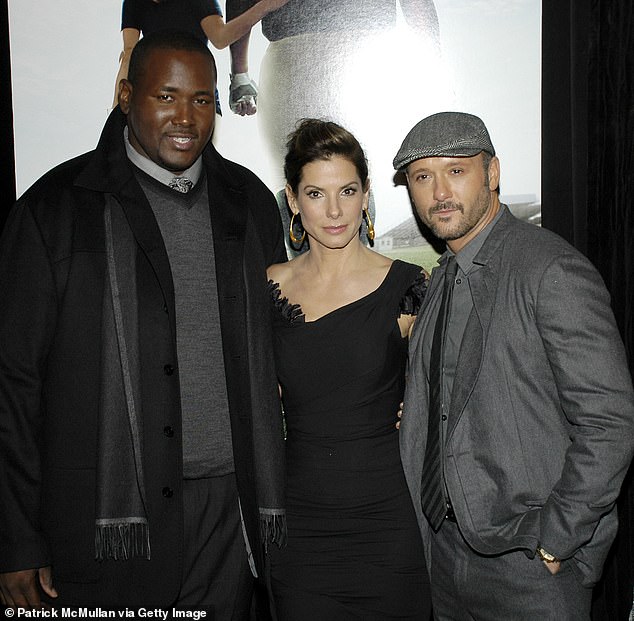 The Oscar-winning actress, 61, stepped out with her 12-year-old amid growing concern for her former The Blind Side co-star Quinton Aaron, who is reportedly 'fighting for his life' after suffering a serious fall at his home (seen in 2009)