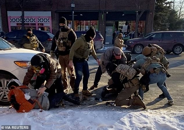 A screengrab from a video obtained by Reuters shows a law enforcement officer pinning down a man identified as Alex Pretti, before he was fatally shot when federal agents were trying to detain him in Minneapolis, Minnesota, U.S., January 24