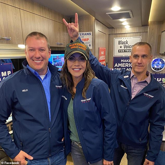 Noem with her close adviser and rumored lover Corey Lewandowski (right)