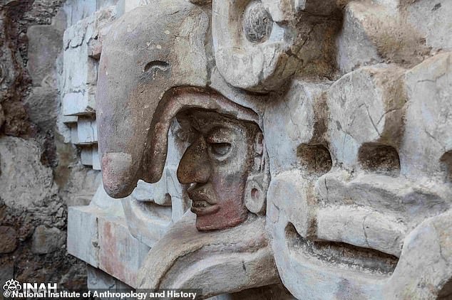 Pictured is the face of the Zapotec god inside the owl's mouth