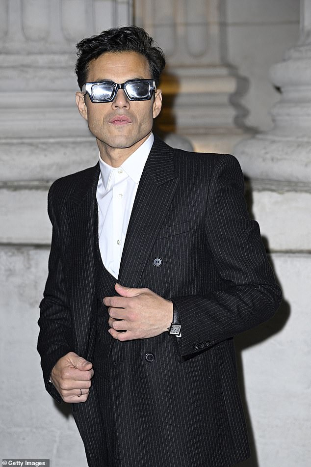 Rami Malek looked cool in sunglasses and a pinstripe suit
