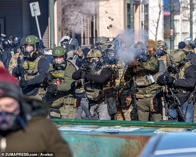 Americans mostly blame Trump and his Immigration enforcement team for the violence in Minneapolis (Pictured: border officials clash with demonstrators in the city)
