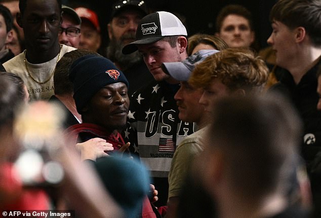 Attendees listen to US President Donald Trump deliver remarks on the economy in Clive, Iowa, on January 27, 2026