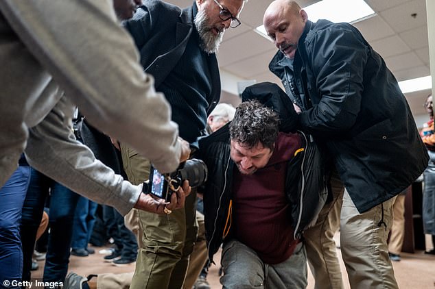 A person is subdued after attempting to attack Rep. Ilhan Omar