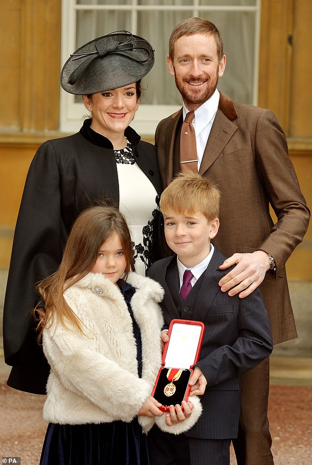 The couple and their children Bella and Ben after he was awarded a knighthood by the Queen at Buckingham Palace in December 2013