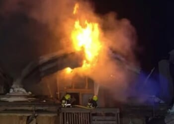 Huge inferno rips through five-star ski resort hotel as hundreds of terrified guests flee weeks after deadly Swiss fire