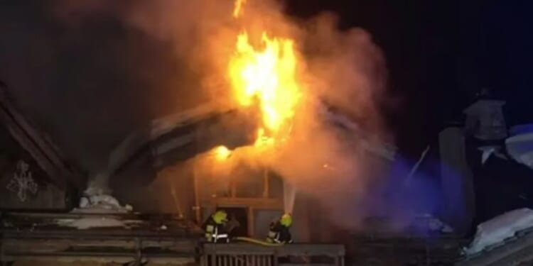 Huge inferno rips through five-star ski resort hotel as hundreds of terrified guests flee weeks after deadly Swiss fire