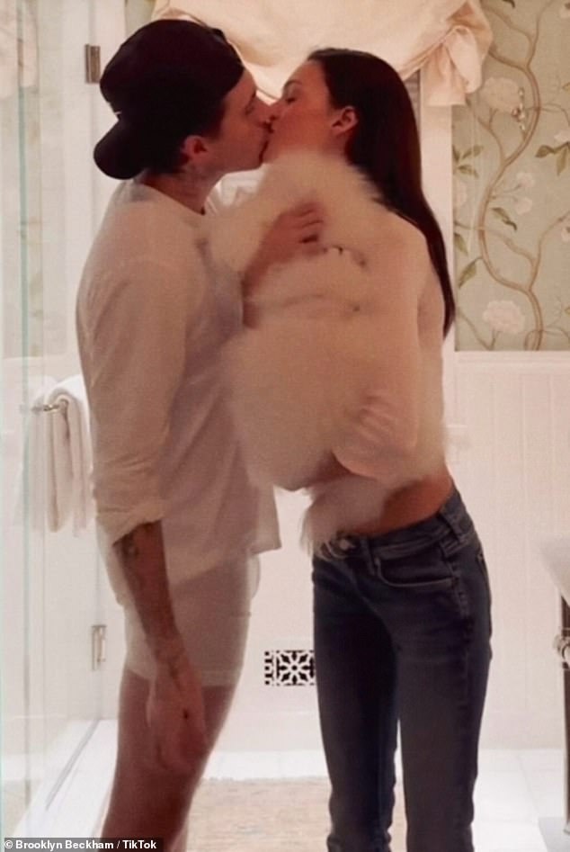 Brooklyn and Nicola kiss with their dog at the hideout in the heart of California's wine country