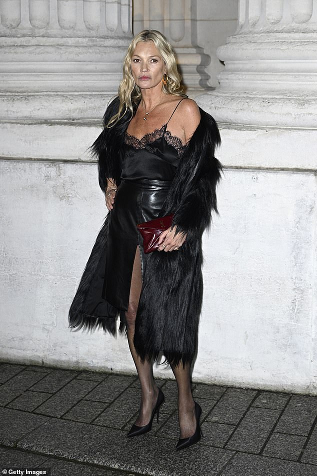 Ever the pro, the model managed to stay standing on her sky-high heels before breaking out her best poses for the cameras