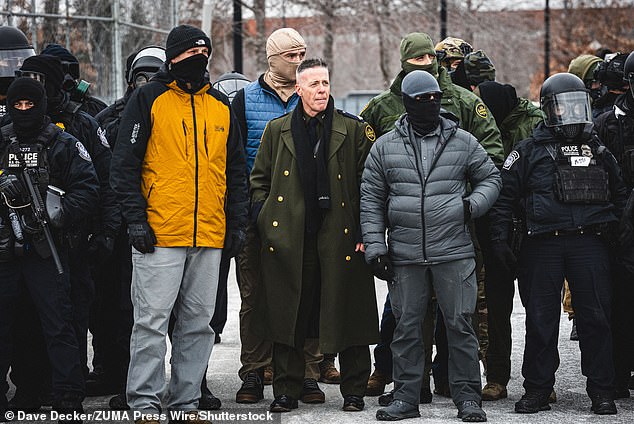 Border Patrol chief Gregory Bovino observes a protest in Minneapolis on January 15