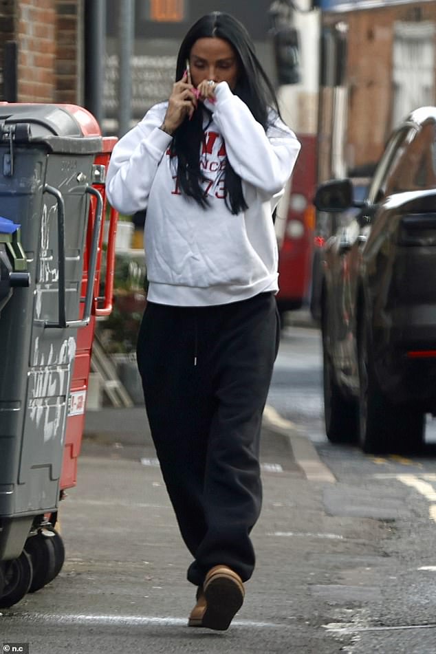 Showing off her new wedding jewellery, Katie opted for a grey hoodie and black tracksuit bottoms as she made her way to her car