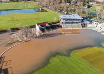 Iconic English stadium left unrecognisable as it is submerged in water after being battered by Storm Chandra