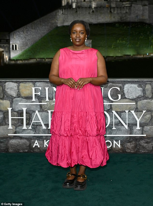 She finished off her red carpet look with a pair of chunky Mary Jane shoes featuring gold buckles and drop earrings