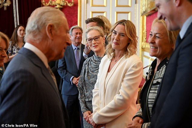 Meryl Streep (centre) and Kate Winslet (third right) watch as King Charles speaks to guests during the King's Foundation Awards ceremony at St James's Palace, London