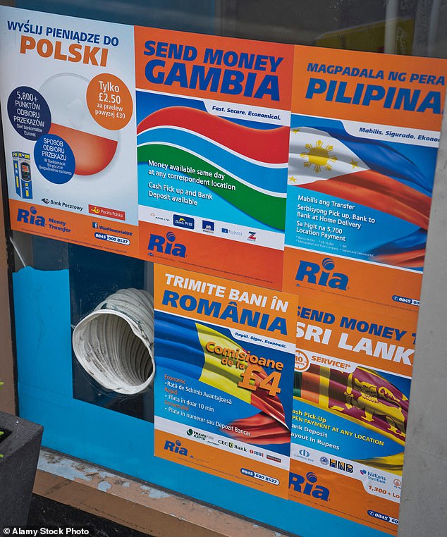Posters like these in Walthamstow, London, advertising money remittance services are increasingly common. An estimated £9.3billion was sent to countries around the world from the UK in 2023
