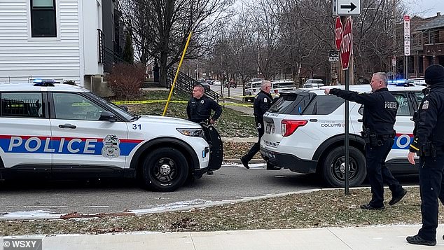 Authorities said that a gun was found on McKee's person when he was arrested. Police are pictured above at the crime scene