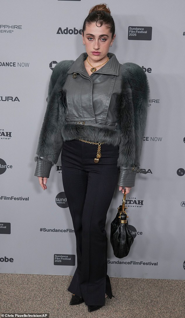 Blast from the past! I Love LA writer Rachel Sennott looked like she was straight out of an early 1990's magazine as she attended the premiere of The Moment on Friday, January 23. She wore a cropped, leather-and-fur style moto jacket, complete with a gold chain belt with hearts hanging off of it and flared pants. She carried a black leather bag with gold hardware detailing, and finished off the look with a bold, gold heart locket around her neck
