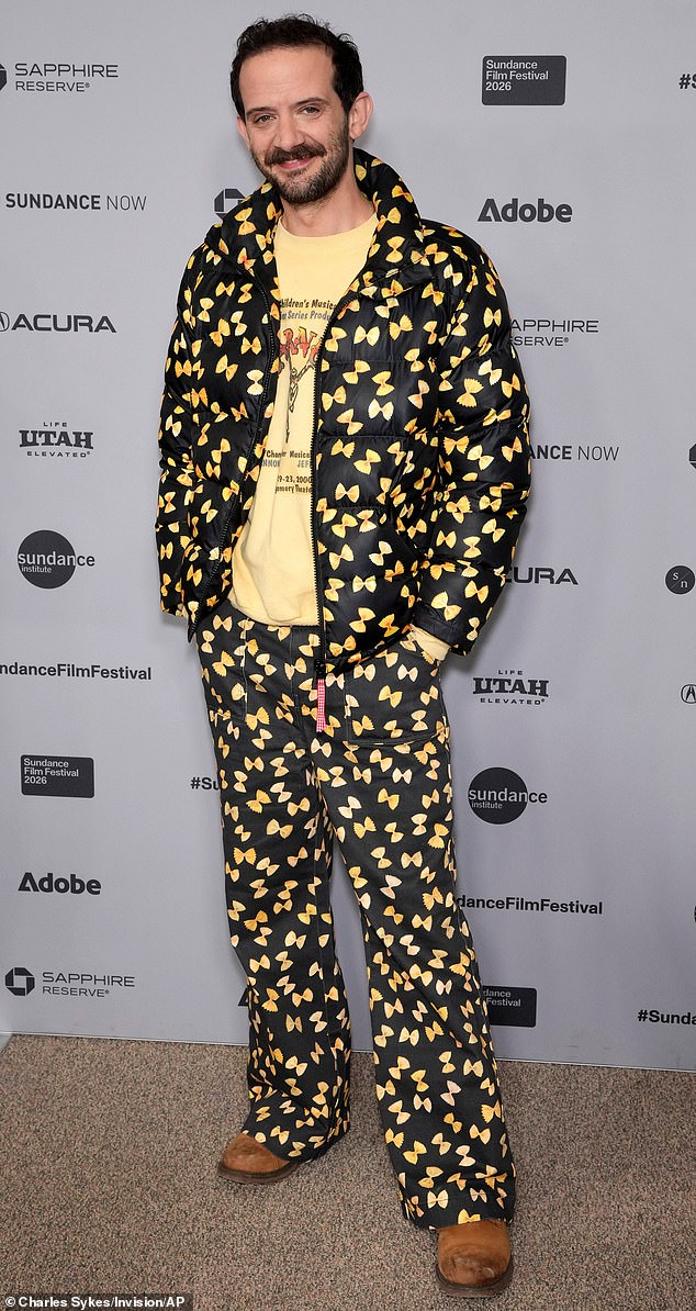 Getting ready for Pasta Night at Olive Garden, or the premiere of The Musical? Actor Will Brill sported a matching pant and puffer coat set on Sunday, which was printed with patterns of bowtie pasta. However, it looked like he was on his way to enjoy a full Italian meal rather than see a movie. Underneath the loud suit, he wore a beat-up yellow sweatshirt, and brought it all together with a pair of worn brown boots