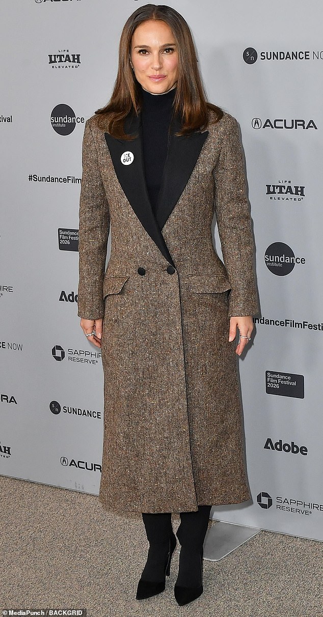 Winter chic! Actress Natalie Portman donned a classic, brown-and-gray tweed coat that featured a v-neck cut. Underneath, she wore a black turtleneck and black suede boots, keeping her classic brown hair down at her shoulders. Portman was attending the premiere of The Gallerist on Saturday